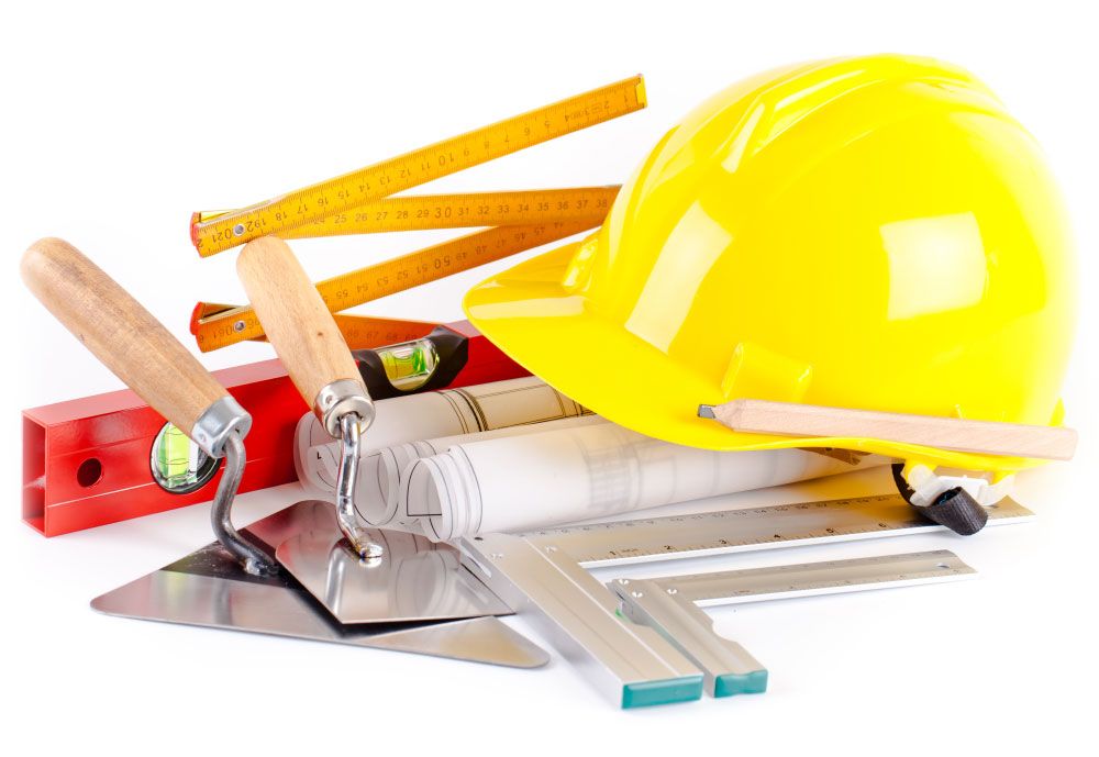 Building materials and construction hat on site